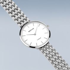 Ladies Titanium  New In: Our new ladies' watches from the Titanium Collection are truly eye-catching. Available in silver, gold and a bicolor look, they are the perfect choice for fashion-conscious women looking for an elegant and robust watch.  The watches are made of high-quality titanium. This material is extremely strong, ultra-light and hypoallergenic. The titanium bracelets fit smoothly and give the watch an elegant and delicate look. The high wearing comfort makes them perfect for daily u Silver Timeless Watch For Everyday, Silver Watches With Metal Dial For Everyday Use, Everyday Silver Watches With Metal Dial, Classic Stainless Steel Watches, Classic Stainless Steel Watch, Classic Stainless Steel Watch With Steel Clasp, Silver Everyday Watch With Polished Finish, Classic Round Stainless Steel Watch, Classic Stainless Steel Round Watches