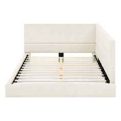 a white bed frame with wooden slats