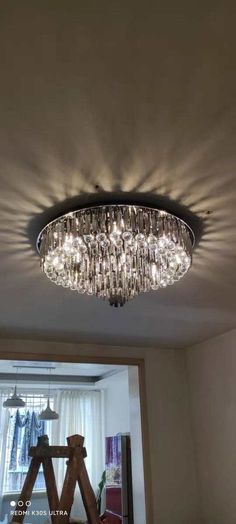 a chandelier hanging from the ceiling in a room