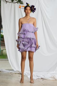 Lavender purple barbie dress featuring front ruffled detailing with floral pattern on the hem. - Aza Fashions Spring Evening Ruffle Mini Dress, Feminine One-shoulder Dress With Ruffles, Spring Evening Mini Ruffle Dress, Purple Ruffled Hem Dress For Party, Spring Party Dress With Ruffle Hem, Purple Dress With Ruffle Hem For Party, Spring One Shoulder Mini Dress With Ruffles, Ruffled Mini Dress For Garden Party, Spring One-shoulder Dress With Ruffled Skirt