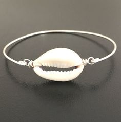 Cowrie Shell, Cowrie Shell Jewelry, Hawaii Shell Bangle, Hawaii Shell Jewelry, Cowrie Shell Bracelet Adjustable Silver Shell-shaped Jewelry, Elegant Silver Charm Bracelet For Beach, White Metal Oyster Bracelet, Handmade Shell-shaped Silver Bracelets, Handmade Silver Shell Bracelets, Silver Shell Jewelry For Beach, Adjustable Bangle Jewelry For Beach, Elegant Shell Bracelet Jewelry, Elegant Adjustable Shell Bracelet