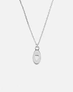 A dainty Heart necklace is suspended from a sleek extra fine chain, freely moving on the chain with a beautiful fluidity. Handcrafted in solid 925 sterling silver. This dainty heart necklace is ideal for everyday wear. Perfect to wear alone, or layer with other necklaces from our collection. ___________________________________ D E T A I L S :▪ Pendant Size - 8x10 mm▪ Solid 925 Sterling Silver Necklace▪ Hypoallergenic▪ Shipped from Berlin▪ Orders to the US - No Customs Fees Upon the Delivery_____ Minimalist Sterling Silver Heart Pendant Necklace, Minimalist Silver Heart Necklace With Delicate Chain, Minimalist Sterling Silver Heart Charm Necklace, Silver Minimalist Heart Necklace For Everyday, Minimalist Open Heart Sterling Silver Necklaces, Minimalist Heart-shaped Sterling Silver Charm Necklace, Sterling Silver Open Heart Charm Necklace With Delicate Chain, Minimalist Sterling Silver Open Heart Charm Necklace, Minimalist Sterling Silver Heart Necklace