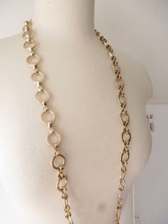 Super cool vintage necklace with a thick statement look Shiny and wide gold tone round links  Wide and chunky look, but it is very light in weight There is no clasp, just one long continuous chain  CONDITION In very good vintage condition. No signs of wear or age. Secure closure MEASUREMENTS  38 inches long.  0.7 inch wide DESIGNER unknown SHIPPING We combine shipping, so have a look around as you will save money on shipping if you purchase more than one item from us in a single checkout.  Any q Vintage Gold Chunky Necklace, Vintage Chunky Gold Necklace, Vintage Round Chunky Chain Necklace, Vintage Chunky Chain Round Necklace, Gold Long Necklace, Canada Post, Cool Vintage, Necklace Vintage, Minimalist Necklace