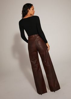 The relaxed wide leg, wide hem, high-rise Mischa makes a statement in supple Chocolate Leather. The natural fade of the cowhide adds dimension to this sophisticated, forever-in-style look.100% Lamb Leather Rise / Waist: ultimate high rise / pinched Hips: fitted at hips Leg: wide leg Average Height: full length 11.5" rise 21.5" knee 22" leg opening 32" inseam Camila is 5'8.5" wearing size 25 Leather Wide Leg Pants For Fall, Fall Leather Wide Leg Pants, Brown Wide Leg Cargo Pants For Fall, Brown Wide Leg Leather Bottoms, Chic Brown Wide Leg Full-length Pants, Chic Brown Wide Leg Full Length Pants, Chic Brown Full-length Wide Leg Pants, Chic Brown Full Length Wide Leg Pants, Fall Brown Wide-leg Leather Pants