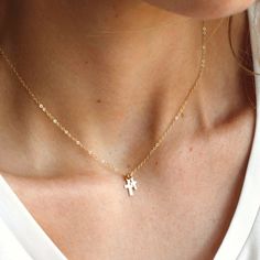 "Double Cross Dainty Necklace & Gifts for Her This double cross necklace is perfect for yourself or as a meaningful, special gift. Designed extra dainty for everyday wear in high quality 14kt gold filled to last over time!  D E T A I L S *Two super tiny cross charms, 6 & 8mm *14kt Gold dainty link chain. LENGTH *Please select from the drop down selection. *The standard length is normally 18\". *Model is wearing the mini at 16\" in Photos. HOW TO PERSONALIZE *Select your choices from the drop down menu to create your custom design. ∙ EXTRA LOVE ∙ Handcrafted just for you in sunny Arizona by a team of talented women. All of our jewelry comes gift packaged! We are happy to leave a note if this is a special gift, just let us know in the message box at checkout. PRODUCTION ∙ TIMES All items are Minimalist Cross Pendant Necklaces For Baptism, Minimalist Cross Pendant Necklace For Baptism, Minimalist Cross Pendant Necklace For First Communion, Minimalist Cross Jewelry For Baptism, Dainty Cross Pendant Necklace For Baptism, Dainty Cross Necklace For Baptism, Cross Necklace For First Communion, Dainty Cross Necklace For First Communion, White Cross Necklace For Baptism