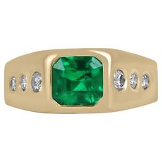 A sophisticated emerald and diamond unisex statement ring. This dapper piece features a remarkable natural AAA quality Colombian emerald, Asscher cut. Fully faceted, this gemstone displays excellent shine and a vivid, dark green color with excellent to very good luster and clarity. Three brilliant round-cut diamonds go from largest to smallest down the shank on both sides; all gemstones are securely bezel set in an 18K yellow gold custom setting. Setting Style: Bezel Setting Material: 18K Yellow Mens Emerald Rings, Emerald Gem, Asscher Cut Diamond, Tiny Bow, Bezel Set Ring, Colombian Emeralds, Minimalist Gifts, Asscher Cut, Yellow Gold Setting