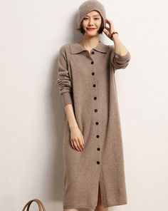 Material: 100% Cashmere Collared Button-Up Cashmere Cardigan Dress, a luxurious and versatile addition to your wardrobe. Crafted with the finest cashmere, this dress seamlessly combines elegance and comfort. The collared neckline and button-up front add a touch of sophistication, while the cozy cashmere envelops you in warmth. Perfect for both casual and dressier occasions, this dress effortlessly elevates your style with its timeless design and sumptuous feel. Embrace a look that transitions se Elegant Sweater Dress With Button Closure For Fall, Elegant Winter Cashmere Dress, Elegant Cashmere Dresses For Fall, Elegant Cashmere Sweater Coat For Fall, Elegant Single Breasted Fall Cardigan, Elegant Single-breasted Winter Cardigan, Elegant Long Sleeve Cashmere Sweater Dress, Long Sleeve Cashmere Sweater Coat In Beige, Long Sleeve Cashmere Work Dress