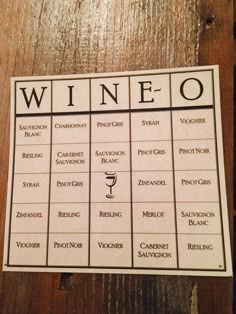 a wine tasting game is shown on a wooden table with the words wine written in it