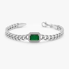 Juliet Embrace bold opulence with the Emerald & Diamond Cuban Bracelet. This exquisite piece showcases a stunning interplay of vibrant emeralds and dazzling diamonds, expertly set within the gleaming links of a 14k solid gold Cuban chain. The emerald's captivating green hues contrast beautifully with the diamonds' fiery sparkle, creating a truly luxurious statement piece. - Handmade- Solid Gold- Natural Diamonds and Emerald - G Color, SI Quality Diamonds- Total Diamond Carat Weight: 0.08 ctw- To Formal Emerald Cut Diamond Bracelet, Modern Formal Emerald Jewelry, Elegant Cuban Link Chain Bracelet With Diamond Cut, Elegant Diamond Cut Cuban Link Chain Bracelet, Elegant Cuban Link Diamond Cut Bracelets, Elegant Cuban Link Chain Bracelet For Formal Occasions, Elegant Cuban Link Bracelets For Anniversary, Elegant Diamond Cuban Link Bracelet For Anniversary, Green Gemstone Diamond Bracelet For Formal Occasions