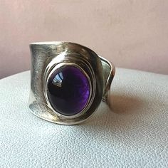 Beautiful Vintage Ring In Wide Band / Wrap / Cigar Style In Solid 925 Sterling Silver ( Stamped And Tested), With Vibrant Color Amethyst Cabochon. The Ring Is Very Versatile, Some What Adjustable In Size Because Of The Open Wrap Design, Very Beautiful! Formal Amethyst Oval Cabochon Ring In Silver, Elegant Sterling Silver Amethyst Ring Oval Cabochon, Elegant Silver Amethyst Oval Cabochon Ring, Elegant Silver Amethyst Ring With Oval Cabochon, Elegant Silver Amethyst Ring, Oval Cabochon, Classic Silver Amethyst Oval Cabochon Ring, Classic Silver Oval Cabochon Amethyst Ring, Classic Silver Amethyst Ring Oval Cabochon, Classic Silver Amethyst Ring With Oval Cabochon