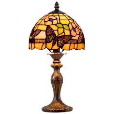 a lamp that is sitting on top of a table with a butterfly design on it