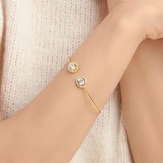 Are you looking for a bangle that's more than just another piece in your collection? Look no further - this zircon bangle is a statement of style, adorned with sparkling crystals that glimmer with every movement. Its lightweight design makes it perfect for everyday wear. Metal: 925 sterling silver Plating: 18k gold Stones: cubic zirconia Size: adjustable from 15 to 19 cm (6" to 7.5") Hypoallergenic: nickel-free materials used therefore suitable for those with metal allergies Adjustable Cubic Zirconia Cuff Bangle Bracelet, Trendy Anniversary Bangle Jewelry, Trendy Rose Gold Cubic Zirconia Jewelry, Rose Gold Cubic Zirconia Bangle, Trendy Cubic Zirconia Bangle Bracelet, Rose Gold Cubic Zirconia Bracelet With Tarnish Resistance, Adjustable Rose Gold Plated Bangle, Rose Gold Plated Bangle As A Gift, Rose Gold Cubic Zirconia Bangle Bracelet