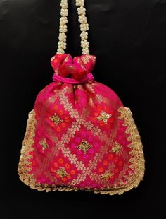 fancy indian handmade woman embroider potli bag | magenta pink flower evening purse | ethnic ladies fabric purse with beaded handlePackage Contents: 1Size: 10" x 8"Designed with the heart, this beautiful Potli or batawa bag are eye catchy and made of premium material.Key Features:Embroidery art work. This potli is good match with both Indian and western outfits and are superb for wedding and festive parties.This would be best complement to your designer saree, lenhga or any other kind of dress.T Festive Pink Embroidered Pouch, Festive Embroidered Pink Pouch, Traditional Pink Pouch For Festive Occasions, Traditional Pink Pouch For Festive Season, Festive Pink Potli Bag For Party, Pink Handwork Potli Bag For Party, Pink Zari Work Potli Bag For Festivals, Traditional Potli Bag With Resham Embroidery For Festivals, Pink Handwork Potli Bag For Diwali