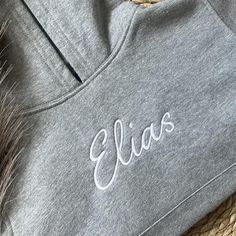 **PLEASE READ ALL DETAILS** There is an up to two week production time for all personalised products. Perfect for those 'in-between' British weather days! This fleece pull-on hoodie is made from a high quality, heavyweight 260-270gsm materials comprised of 60% cotton and 40% polyester blend. It has a lined hood, fine knit rib cuffs and hem and a front pouch pocket. The embroidered area is backed with 2 layers of high quality stabiliser to ensure longevity of stitches when washing. Available in a Gray Embroidered Logo Hoodie Sweatshirt, Gray Hoodie Sweatshirt With Embroidered Logo, Customizable Cotton Hoodie, Customizable Cotton Hooded Hoodie, Hooded Sweatshirt With Embroidered Logo For Loungewear, Sporty Hooded Hoodie With Custom Embroidery, Custom Embroidered Fleece Hoodie, British Weather, Weather Day