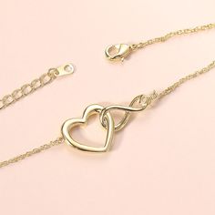 ✦ Show your eternal love with the Infinity Heart Pendant Necklace! No matter the relationship, this exquisite necklace celebrates the endless joy of love. The heart and infinity symbols combined represent never-ending devotion, while the inlaid clear zircon signifies purity and tranquility. Always express your unwavering love for your special someone with this stunning necklace. ----------- DETAILS ----------- - Materials: 925 Sterling Silver, Cubic Zirconia - Necklace Length: 40cm + 5cm - Pendant Size: 0.6*0.9cm - SKU:YS127 Sterling Silver Infinity Heart Necklace For Anniversary, Elegant Adjustable Open Heart Jewelry, Elegant Adjustable Double Heart Necklace, Elegant Open Heart Bracelet As Gift, Elegant Open Heart Bracelet For Gift, Elegant Adjustable Heart Charm Necklace, Elegant Adjustable Necklaces For Anniversary Gifts, Elegant Heart Bracelet For Valentine's Day With Delicate Chain, Elegant Adjustable Necklace For Anniversary Gift