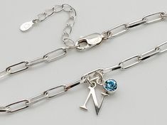 This sterling silver initial and birthstone bracelet is perfect for gifting, the easy sizing makes it ideal to buy for someone special WARRANTY This bracelet is covered by a 6 month warranty EXCHANGES I'm happy to offer returns and exchanges GIFT WRAP If you are purchasing this item as a gift, I offer gift packaging as an added extra. The gift wrap option includes your jewellery in a Mia Rose pouch, a gift card with your gift message if you choose to leave one (if no message is left, you will re Silver Charm Bracelet With Initials For Gift, Silver Charm Bracelet With Initials As Gift, Personalized Silver Name Bracelet For Her, Personalized Silver Name Bracelet As Gift For Her, Sterling Silver Charm Bracelet With Initials In Silver, Silver Dainty Name Bracelet With Birthstone, Dainty Silver Name Bracelet With Birthstone, Personalized Silver Charm Bracelet With Birthstone, Silver Sterling Silver Charm Bracelet With Birthstone