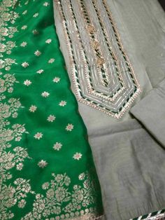 Item Overview ATHARVA Hand Embroidery Salwar Kameez w/Embroidered Neck Grey/Banarsi Silk Dupatta Green/Tunic Pants/Patiala Salwar/Churridar/Custom Stitch/ Dno. CH1455 Fabric: * Shirt Chanderi 2.5 Mts, Grey - Embroidered Neck * Dupatta: Banarsi Silk Dupatta 2.5 Mts. (Motifs May Wary) * Bottom Santoon Silk 2.5 Mts. Excusive Hand Embroidered Party Wear Punjabi Suit. Customization: * Fabrics Customization: Designs Can be made in different Fabrics. *Color Customization: Designs can be made in any col Bollywood Style Pista Green Jamawar Sets, Unstitched Pista Green Suit With Zari Work, Festive Bollywood Unstitched Suit In Pista Green, Bollywood Style Pista Green Unstitched Suit For Festive, Festive Pista Green Chanderi Kurta, Embroidered Cotton Silk Churidar With Straight Kurta, Semi-stitched Pista Green Chanderi Kurta, Festive Embroidered Straight Kurta Churidar, Embroidered Pista Green Chanderi Kurta