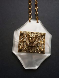 Egyptian revival brass and resin necklace Immitation of mother of pearl with Pharaoh relief Previously owned can show signs  of wear and tarnish new jump rings connecting chain with pendant Bohemian Gold Resin Necklace, Vintage Gold Resin Jewelry, Handmade Rectangular Brass Necklace, Art Deco Brass Pendant Jewelry, Resin Necklace, Pearl Chain, Resin Pendant, Jump Rings, Necklace Etsy