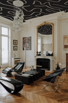 an elegant living room with black leather chairs