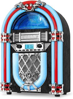 an old fashioned jukebox with blue and red pipes