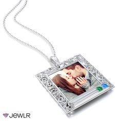 a necklace with an image of a couple on it