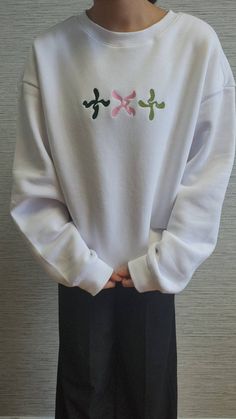 This cozy sweatshirt is perfect for any Kpop fan looking to add some style to their wardrobe. Crafted from high-quality cotton fabric, our crewneck sweatshirt is soft, comfortable, and durable. The front of the sweatshirt features a beautiful embroidery of the txt logo, showcasing your love and support for this talented Kpop group. The sweatshirt is available in a range of sizes to suit all body types, and the classic design makes it a versatile addition to any outfit. Wear it to concerts, fan m Txt Sweatshirt, Kpop Embroidery, Kpop Sweatshirt, Txt Logo, Kpop Gifts, Pop Clothes, Kpop Clothes, Kpop Group, Embroidery Sweatshirt