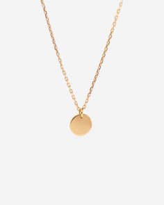 This simply elegant disc pendant necklace is handcrafted in vermeil, a thick 18K gold layer on solid 925 sterling silver. It is sturdy for everyday wear. This versatile necklace can be worn beautifully alone or layered with other necklaces. _____________________________________ D E T A I L S : ▪ Disc Diameter - 10mm▪ Model Wears - 45cm/17.7 inches▪ 18K Gold Vermeil Necklace▪ Base Metal - Solid 925 Sterling Silver▪ Hypoallergenic▪ Shipped from Berlin▪ Orders to the US - No Customs Fees Upon the D Necklace Stacking, Disk Necklace, Gold Vermeil Jewelry, Necklace Layering, Necklace Minimalist, Disc Pendant, Vermeil Jewelry, Disc Necklace, Layering Necklace