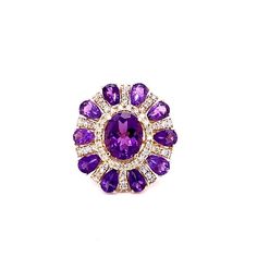 This ring has a Natural Oval Cut Amethyst that weighs 3.28 carats and Natural Pear Cut Amethysts that weigh 3.28 carats. It also has Natural Round Cut Diamonds that weigh 1.06 carats. The total carat weight of the ring is 8.28 carats. Curated in 14 Karat Yellow Gold. The ring is a size 7 and can be re-sized at no additional cost. Yellow Gold Cocktail Ring, Gold Cocktail Ring, Gold Cocktail, Pear Cut, Cocktail Ring, Round Cut Diamond, Jewelry Designs, Cocktail Rings, Free Jewelry