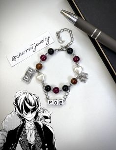 -Handmade Edgar Allan Poe inspired bracelet with dangling charms and name tag -Adjustable with semi-loose fit on smallest setting -Made with stainless steel, acrylic beads, and plastic charms -Take care when handling and do not tug on the bracelet, as it is handmade and delicate. May appear tangled occasionally but is easy to fix Adjustable Personalized Dangle Bracelets, Adjustable Metal Name Bracelet With Charms, Personalized Adjustable Dangle Charm Bracelet, My Chemical Romance Bracelet, Bsd Bracelet, Poe Bungou Stray Dogs, Alpha Werewolf, Plastic Charms, Cute Text Symbols