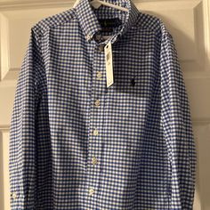 Boys Ralph Lauren Gingham Blue And White Cotton Shirt Brand New Never Worn Size Small (8) Excellent Condition From A Smoke Free/Pet Free Home. Plaid Collared Shirt For School, Plaid Long Sleeve Shirt For School, Ralph Lauren Plaid Collared Tops, Ralph Lauren Collared Plaid Tops, Preppy Ralph Lauren Spring Shirt, Ralph Lauren Preppy Spring Shirt, Blue School Shirt With Button Closure, Blue School Shirt For Spring, Blue Spring Shirt For School