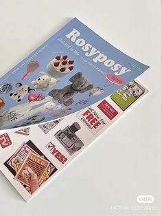 a magazine cover with pictures of cats and dogs on it's front page, sitting on a white surface