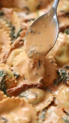 a spoon is being used to scoop some food out of the pan with sauce on it