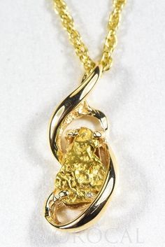 "Gold Nugget Pendant \"Orocal\" PN784NX Genuine Hand Crafted Jewelry - One of a Kind - 14k Casting-Approx. Total weight = 4.49G \" If this is not in Stock our Jeweler will make it in 4-6 weeks\" Specs and Dimensions: Length/Width Quartz Stone Size Bail Size - 6.25 x 1.25 mm With This Stunning Pendant you will receive a certificate of authenticity each of these Nuggets are placed in carefully by the Jeweler like a puzzle and it's very Labor intensive . Each Nugget is Natural and Found from the Mi Gold Nugget Jewelry, Natural Gold Nugget, Wrightsville Beach Nc, Wrightsville Beach, Gold Nugget, Natural Gold, Gold Flakes, Hand Crafted Jewelry, Crafted Jewelry