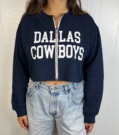 "Dallas Cowboys Cropped Zip-up Sweatshirt Size:  Various Sizes Available- unisex fit Model is 5'9' and wearing a medium size with a 13\" zipper in the photo Choose your zipper length at checkout: 13\" Zipper is shown in photo, this will show some stomach 15\" Zipper usually hits waist line" Throwback Fan Gear Tops For Fall, Relaxed Fit Throwback Tops For Fall, Cotton Tops With Zipper Closure For Fall, Throwback Cotton Tops For Fall, Throwback Style Cotton Tops For Fall, Casual Tops With Zipper Closure And Relaxed Fit, Blue Cotton Top With Zipper Closure, Blue Cotton Tops With Zipper Closure, Throwback Letter Print Tops For Fall