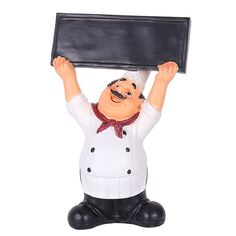 a statue of a chef holding up a black board