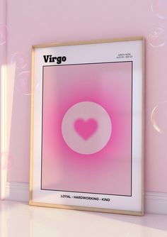 a pink poster with a heart in the middle and bubbles around it on a wall