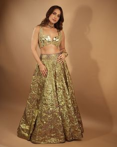 Introducing the Lampi lehenga set, a stunning ensemble that embodies timeless elegance and contemporary charm. The lehenga features intricate mirror work, meticulously handcrafted to accentuate its rich texture and vibrant hues. Paired with a matching mirror-embellished blouse and complemented by a mirror dupatta, this ensemble exudes grace and sophistication, perfect for any special occasion or celebration. Kusha Kapila, Mirror Dupatta, Intricate Mirror, Ambani Wedding, Golden Lehenga, Gold Lehenga, Mirror Work Lehenga, Padded Blouse, Embellished Blouse