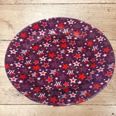 a purple plate with red and white stars on it