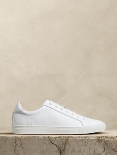 We designed this leather sneaker with a minimalist silhouette to offset athletic appeal with a bit of elegance.  We also added lightweight, durable OrthoLite® performance insoles for breathable cushioning that wicks away moisture for ultimate comfort.  Leather uppers.  Rubber soles.  B width. White Leather Dress, Minimalist Silhouette, White Sneakers Women, White Leather Sneakers, Minimal Outfit, White Trainers, Dress With Sneakers, White Shoes, Wicks