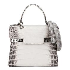 Mightychic offers a Limited Edition Delvaux Tempete PM bag featured in Blanc Casse Himalayan Crocodile. Exquisite and sought after, the Himalaya Crocodile Tempete is a one of one created, making this a collectors treasure. Inspired by a sailboat's trapeze, the Delvaux Tempete was designed in the 1960s for the Yachting Collection. Two metal studs on each side of the front has a unique clasp that can be left open or closed. Each way gives a different flair and feel to the bag. The front flap has a Delvaux Tempete, Delvaux Bag, Dream Bags, Limited Edition Bag, One Of One, Crocodile Bags, Bag Collection, Hermes Handbags, Jewelry Inspo