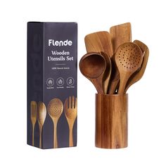 wooden utensils set in a bamboo holder with matching spoons and spatulas