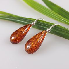 Natural Baltic Amber earrings, all parts sterling silver 925. Genuine brown Baltic amber. Certificated amber gemstone and silver with all hallmarks. Lenght about 5cm. Amber length 2.3 cm. Long but elegant earrings. https://www.etsy.com/shop/AmberLithuania?ref=simple-shop-header-name&listing_id=780205095&section_id=27948198 This item was made of natural Baltic Amber. All the amber used in my jewelry is collected in my home country Lithuania. I sell only genuine, real, not pressed, authent Hypoallergenic Brown Sterling Silver Earrings, Formal Brown Sterling Silver Earrings, Brown Sterling Silver Drop Earrings, Elegant Single Amber Earring, Baltic Amber Drop Earrings, Baltic Amber Dangle Earrings, Amber Sterling Silver Hypoallergenic Earrings, Hypoallergenic Sterling Silver Amber Earrings, Hypoallergenic Amber Sterling Silver Earrings