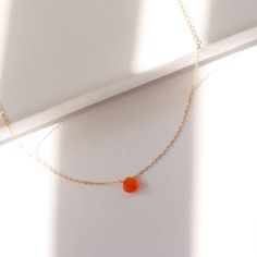 ⏰ PROCESSING TIME BEFORE DISPATCH: 3 - 5 business days ----------------------------------------- Vibrant and dainty, this delicate carnelian necklace features a genuine carnelian teardrop stone hand wire-wrapped directly into a 14k gold filled or sterling silver chain. Adorned with LUNNARUS' signature natural blue lace agate bead detailing near the spring ring clasp. // CARNELIAN Believed by the Romans to be a stone of courage, carnelian is a variety of chalcedony. Carnelian exhibits vibrant col Chakra Gifts, Carnelian Jewelry, Carnelian Crystal, Carnelian Necklace, Carnelian Pendant, The Romans, Necklace Gemstone, Gemstone Necklace Pendant, Blue Lace Agate