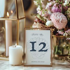 a table with flowers and candles on it