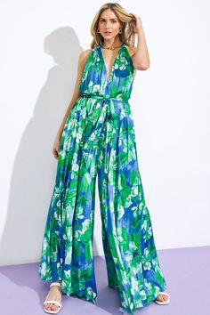 A printed woven jumpsuit featuring V halter neckline, sleeveless, self sash tie, wide leg, bare back with neck tieDetails:Self: 97% Polyester 3% SpandexLining : 100% Polyester Size & Fit- Model is 5`8" And Wearing Size Small- Measurements Taken From Size Small- Approx. Length: 63" Spring Green Tie Back Jumpsuits And Rompers, Spring Green Jumpsuits And Rompers With Tie Back, Spring Green Jumpsuit With Tie Back, Green Halter Neck Jumpsuit For Beach, Spring Halter Neck Jumpsuit With Tie Back, Blue Sleeveless Tie Back Jumpsuit, Green Wide-leg Jumpsuits And Rompers For Spring, Green Wide Leg Jumpsuits And Rompers For Spring, Blue Halter Neck Jumpsuits And Rompers For Spring