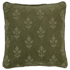 a green pillow with leaves on it