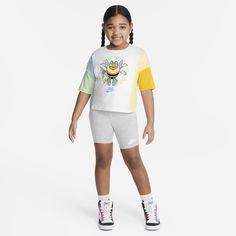 Easily dress your busy bee for warm weather fun with this 2-piece set. The graphic tee has dolman sleeves and a boxy cut that creates a modern, flattering look. The matching bike shorts have added stretch for freedom of movement with an elasticized waistband that provides a comfy fit your kiddo will be buzzing in. Summer Athleisure T-shirt For Playwear, Playful Sports T-shirt For Summer, Summer Sportswear Tops For Playwear, Sportswear Tops For Playwear, Short Sleeve Sportswear Tops For Play, Sporty T-shirt For Playwear In Spring, Sporty T-shirt For Spring Playwear, Sporty Spring T-shirt For Playwear, Playful Multicolor Sports Top