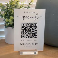 a sign that says, let's get social like willow + barn on it