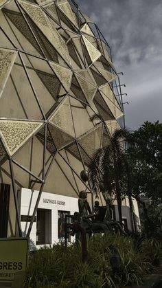 a large building with lots of umbrellas hanging from it's sides