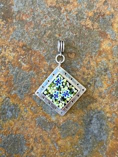 A beautiful statement piece, this pendant is handmade using individually cut tiny pieces of glass called "filate." My process is based on the ancient Italian technique of creating micro-mosaic jewelry - but with a modern twist. Signed and dated on the back. 1 1/16" x 1 1/16" Sterling silver over brass Chain not included Free shipping MIcro-mossaics are a special form of mosaic that use unusually small mosaic pieces of glass. The size of each piece can be a little as the lead in a mechanical pencil. Small Mosaic, Micro Mosaic Jewelry, Mosaic Jewelry, Floral Mosaic, Mosaic Pieces, Gilbert Az, Micro Mosaic, Mechanical Pencil, Brass Chain